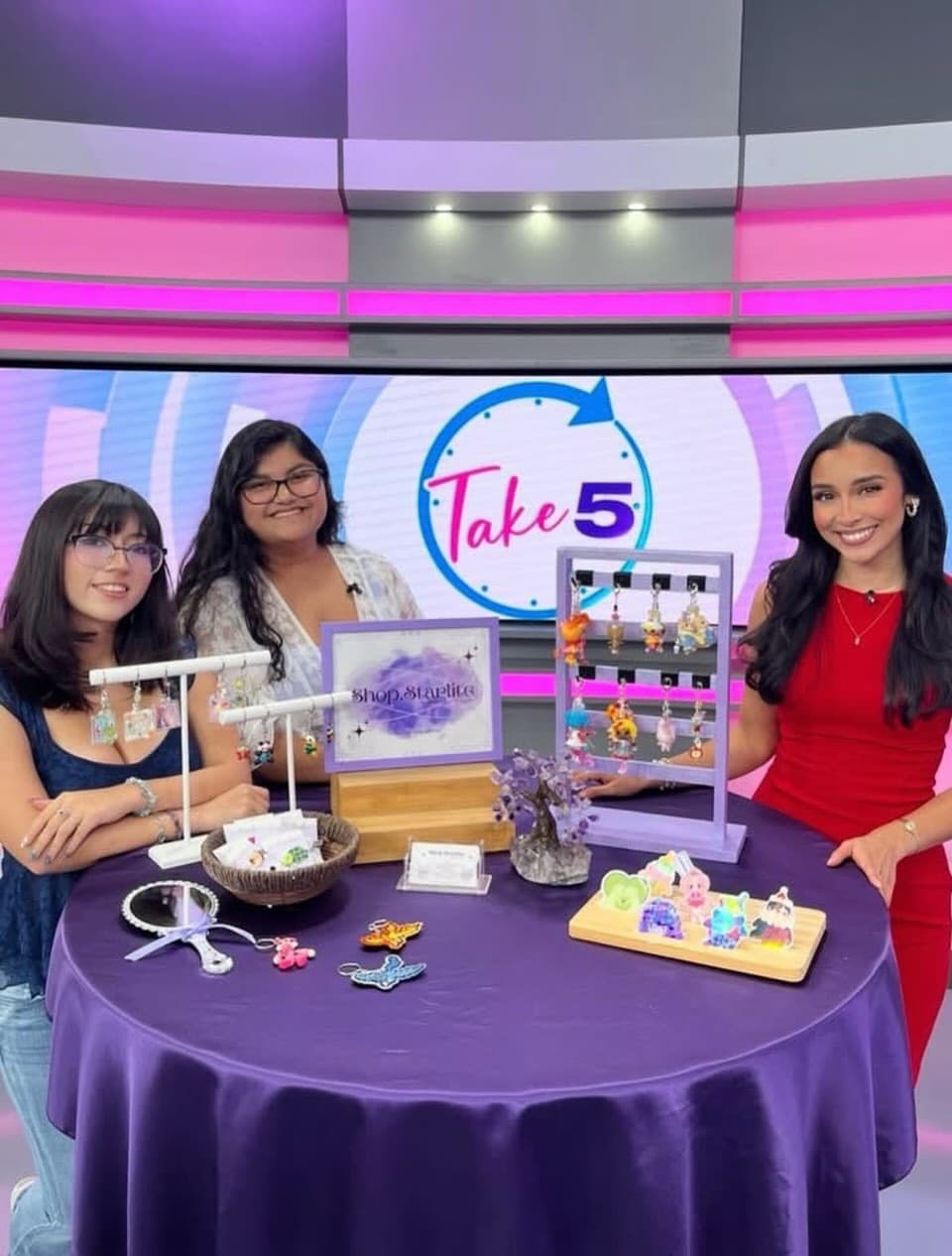 Abby and Ava presenting their Shop Starlite jewelry at the Take 5 studio table.